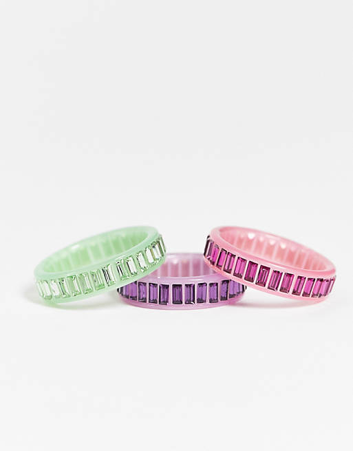 ASOS DESIGN pack of 3 plastic rings with coloured baguette crystals